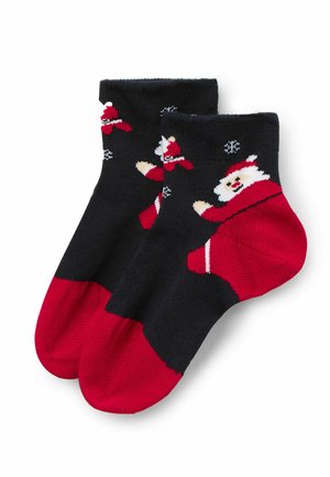 Calze fino al ginocchio con corpo nero, punta e tallone rossi. Presentano un motivo festivo con Babbo Natale, dettagli bianchi e fiocchi di neve. Tessuto morbido.
