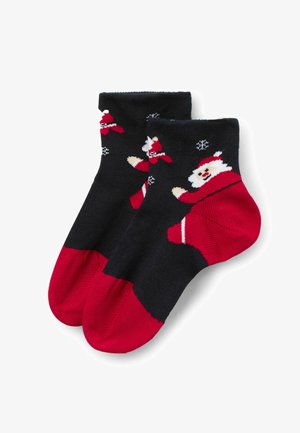 Calze fino al ginocchio con corpo nero, punta e tallone rossi. Presentano un motivo festivo con Babbo Natale, dettagli bianchi e fiocchi di neve. Tessuto morbido.