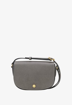 Gray leather crossbody bag with structured shape, gold-tone hardware, and adjustable strap. Textured surface with circular emblem detail.