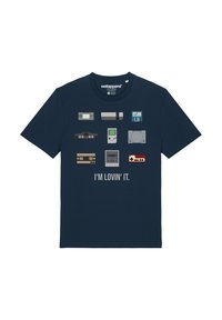 Navy blue cotton t-shirt featuring graphics of gaming consoles and devices, with the text "I'M LOVIN' IT" in gray below the designs.