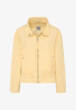Light yellow zip-up jacket with stand collar, snap-button pockets on sides, and elasticated hem and cuffs.