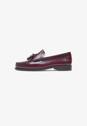 Bordeauxfarbene Leder Slipper mit glatter Oberfläche, dekorativen Quasten und niedrigem Blockabsatz. Mit dezenten Nähten und ausgeschnittenen Akzenten.