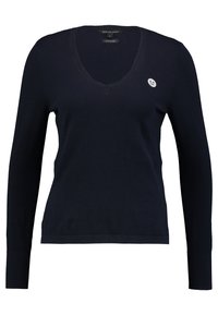 Navy blue knitted pullover with a V-neck and long sleeves. Features a small logo patch on the left chest, made of soft cotton fabric.