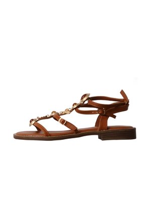 Sandalo piatto marrone con cinturino alla caviglia, fibbia laterale e decorazioni dorate e ambrate lungo il cinturino superiore.