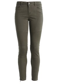 Olivgröna, åtsittande jeans gjorda av stretchigt tyg. Har ribbade detaljer vid knäna och dragkedjeavslut för extra detalj.