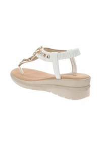 Sandali wedge bianchi con una fascia testurizzata e decorazioni. Soletta imbottita, suola flessibile e design a infradito.