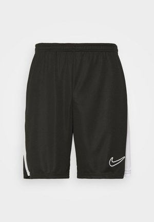 Pantaloni sportivi neri realizzati in tessuto leggero, con un pannello laterale bianco e un logo Nike bianco sul frontale. Vita elasticizzata.