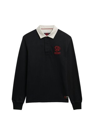 Camisa de rugby de manga larga en algodón negro con un cuello blanco. Presenta un logo rojo bordado en el pecho y una etiqueta en el dobladillo.