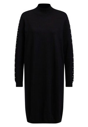 Longue robe noire en tricot avec un col haut et des manches longues ornées de petites perles le long des bords extérieurs.