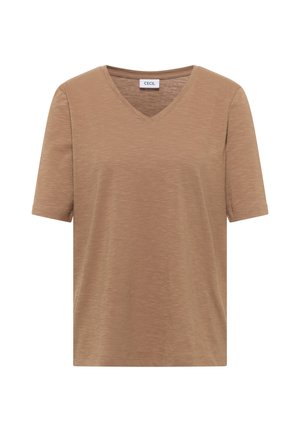 Femme aux cheveux courts et bruns portant un t-shirt marron uni à manches courtes et un jean bleu clair, vue de dos et de profil latéral.