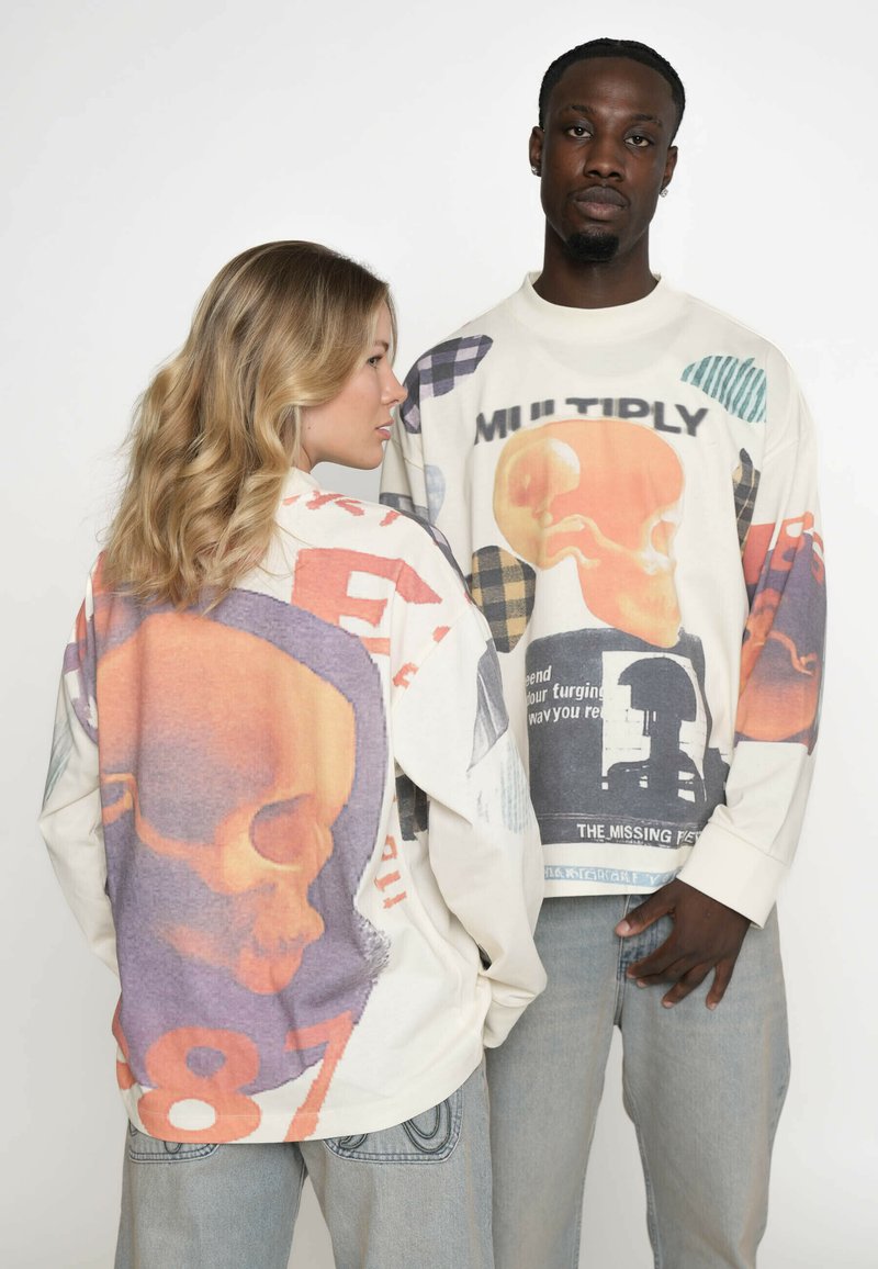 Langärmlige grafische Shirts aus leichtem Material; verfügen über übergroße Schädelmuster, lebendige Farben und verschiedene Muster. Lockere Passform mit gerippten Bündchen.