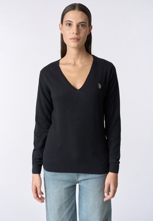 Maglione nero aV con maniche lunghe, realizzato in materiale morbido. Presenta un piccolo logo ricamato sul petto sinistro, polsini e orlo a costine.