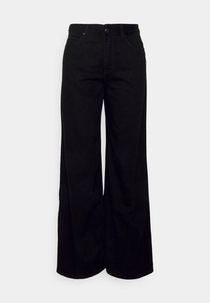 Jeans larghi neri, in denim, a vita alta, con cinque tasche, chiusura frontale con bottone e zip, caratterizzati da linee pulite e senza motivi visibili.