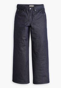 Φαρδιά τζιν παντελόνια από σκούρο τζιν με σχέδιο πέντε τσαντών, αντίθετες ραφές και κούμπωμα με κουμπί. Απαλή υφή με ομοιόμορφη φινέτσα στην επιφάνεια.