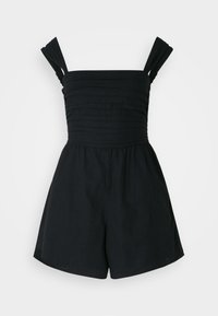 Mono negro con tirantes anchos plisados, cuerpo ajustado y pantalones cortos sueltos. Fabricado con un tejido ligero y de textura suave.