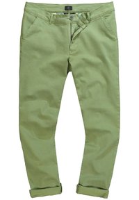 Pantaloni di cotone verdi con un design aderente, dotati di chiusura a bottoni, tasche laterali e orli rimboccati. Texture liscia e dettagli minimi.