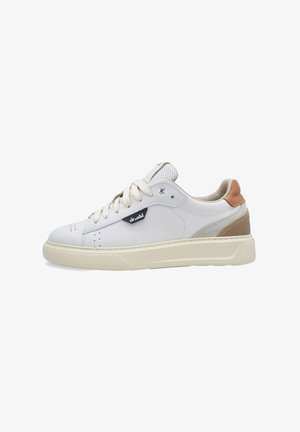 White leather sneaker with beige accents, round toe, perforated details, and flat laces. Features a textured sole and a logo on the side.