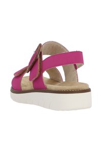 Rosa Sandalen mit glatter Oberfläche, featuring einer großen dekorativen Schleife, braunen Akzenten und einer gepolsterten Sohle mit einer weißen Plattformbasis.