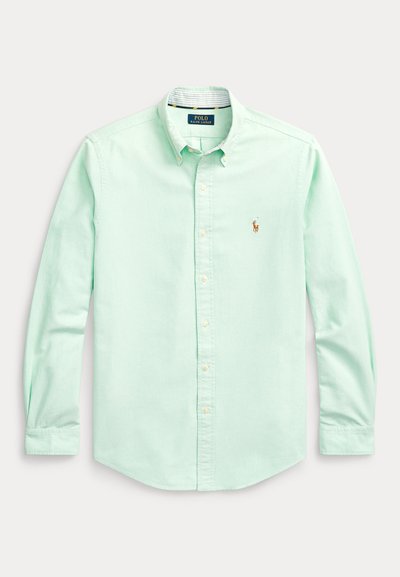 Mint green long-sleeve button-up shirt with a collar, featuring a small embroidered logo in brown on the left chest, and button detailing.