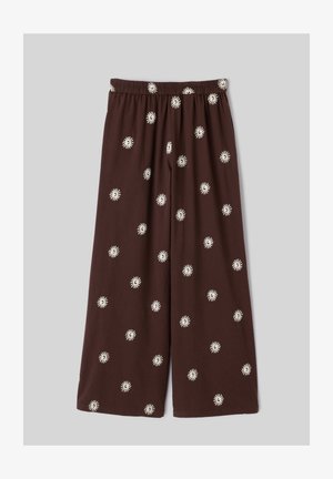Pantalon marron à jambes larges avec une taille élastique, décoré de petits motifs blancs dispersés en forme de soleil.