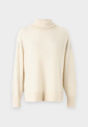 Lys beige høyhalset genser laget av mykt stoff. Har raglanermer og ribbestrikkede ermer og nederkant. Enkel, udekorerte design.