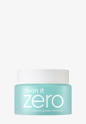 Purkki Clean It Zero -uudistavaa puhdistusbalmia turkoosissa rasiassa ja valkoisella kannella valkoista taustaa vasten.