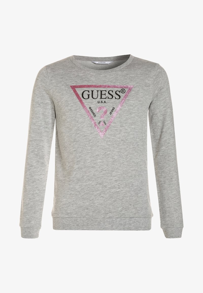 Sweatshirt gris à manches longues, arborant un logo triangle rose étincelant avec "GUESS" et "U.S.A." en texte noir au centre.