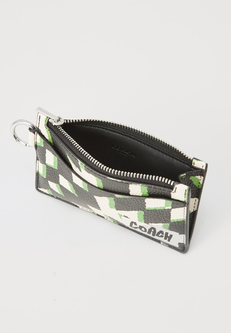 Black leather wallet with green and white geometric pattern, zip closure, and silver hardware. Features a key ring attachment.