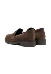 Brown suede loafers with a rounded toe, flat rubber sole, and decorative stitch detail on the upper. No visible hardware or accents.