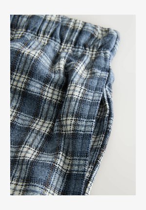 Tessuto a quadri blu e bianchi, con una consistenza morbida e una cintura elastica. Dettagli di cucitura notevoli e una vestibilità rilassata.