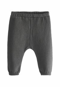 Grijze katoenen peuterbroek met een elastische tailleband, taps toelopende boorden en een zachte, gestructureerde stof. Eenvoudig ontwerp zonder patronen.
