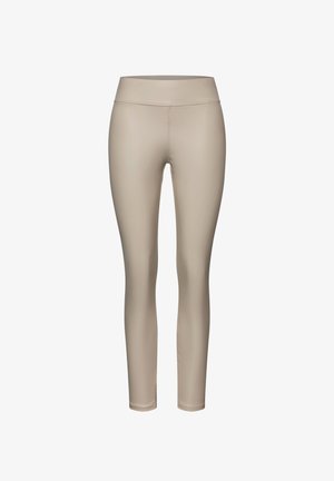Beige leggings gemaakt van soepel, rekbaar materiaal. Voorzien van een hoge taille en een aansluitend ontwerp, geschikt voor sportkleding of casual kleding.