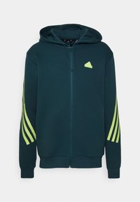 Hooded zip-up dukserica u tamno tirkiznoj tkanini s mekom teksturom. Ima neonsko zelene trostruke akcente na rukavima i logo na prsima.