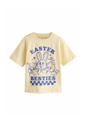 Yellow short-sleeve T-shirt featuring blue graphic of cartoon animals with "EASTER BESTIES" text and checkered pattern at the bottom.