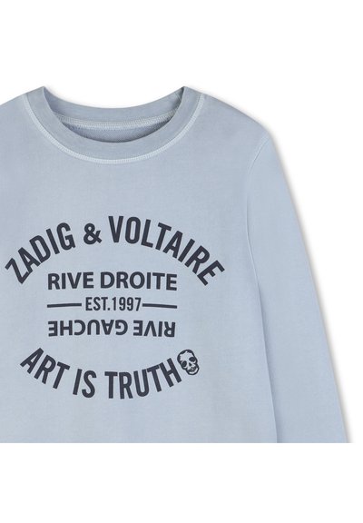Ανοιχτό μπλε φούτερ με στρογγυλή λαιμόκοψη και μαύρο κείμενο «Zadig & Voltaire», «Rive Droite», «Est. 1997», «Art is Truth», και ένα μικρό γραφι κό κρανίου.