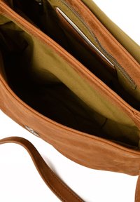 Brown leather handbag with a smooth texture, featuring multiple compartments including a zippered pocket and a green canvas lining.