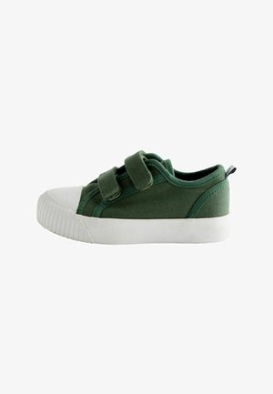 Grøn lærreds-sneaker med hvid gummisål og tåhætte, der har to justerbare velcrolukninger.