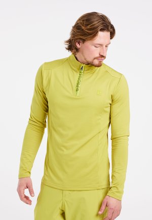 Langarm kwart-rits top in lichtgroene stof, met platte naden, een hoge kraag en een logodetail op de rits.