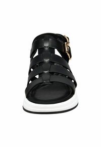 Black leather sandal with woven straps and a gold buckle accent. Features a cushioned black footbed and a white sole.