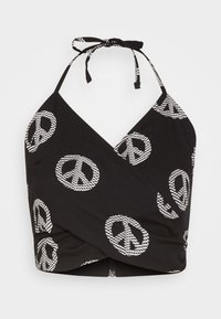 Černý bikiny top na zavazování za krk s omotávacím designem, zdobený bílými vzory mírového symbolu. Vyrobený z měkké tkaniny, s nastavitelnými zavazovacími ramínky.
