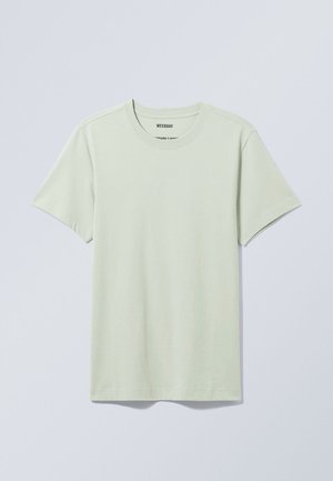 T-shirt vert clair à manches courtes en coton doux. Doté d'un col rond et d'une coupe décontractée, avec un design simple et sans motifs.