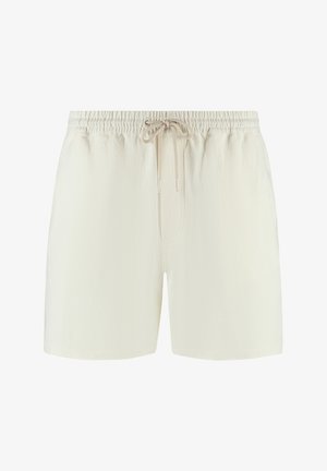 Pantalones cortos de color beige claro hechos de tela texturizada, que presentan una cinturilla elástica con cordón y un ajuste relajado.