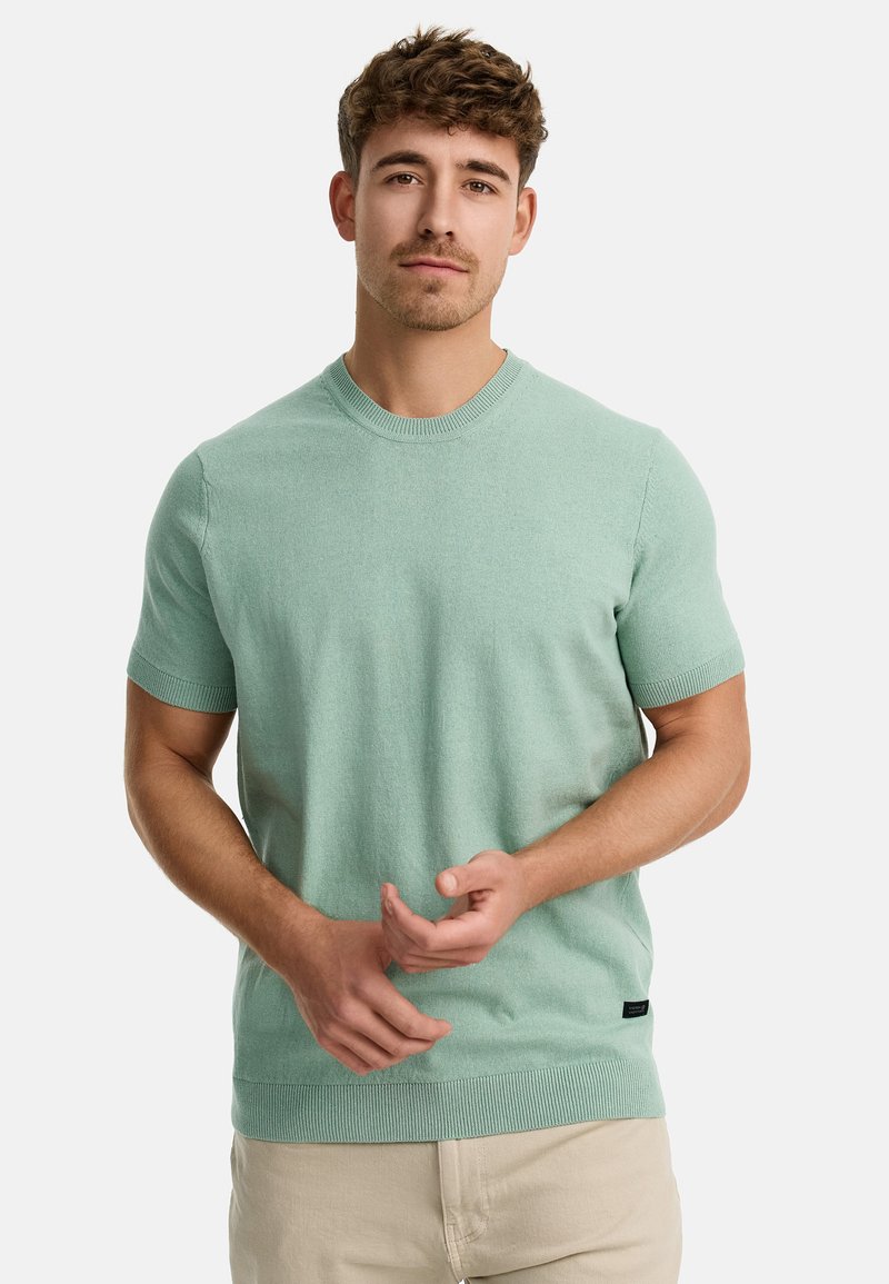 Mintgrøn kortærmet sweater med rund halsudskæring, ribbede manchetter og nederste kant samt en glat, blød tekstur. Enkelt design uden mønstre.