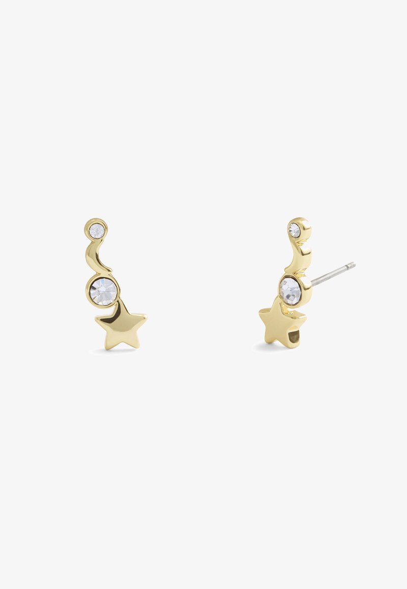 Pendientes en tono dorado con forma de estrella y diseño curvado, adornados con piedras facetadas transparentes para un mayor detalle y brillo.