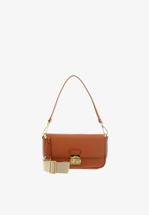 Brown leather shoulder bag with gold clasp and detachable beige adjustable fabric strap on white background.