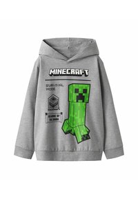 Grijze hoodie met een groene Minecraft Creeper-karakterafbeelding, de tekst "SURVIVAL MODE" en zwarte accenten. Zachte textuur en standaard pasvorm design.