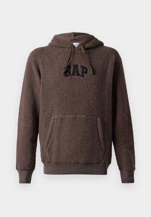 Brauner Fleece-Hoodie mit einer Kängurutasche, gerippten Bündchen und Saum sowie einem schwarzen "GAP"-Logo auf der Vorderseite. Strukturierter, weicher Stoff.
