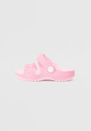 Sandali rosa glitterati con design open toe e cinturino regolabile. Realizzati in materiale flessibile, presentano una suola testurizzata per una migliore aderenza.