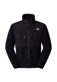 Czarna kurtka na zamek błyskawiczny z gładką górną częścią i polarową dolną częścią. Posiada kieszeń na piersi oraz logo po lewej stronie.