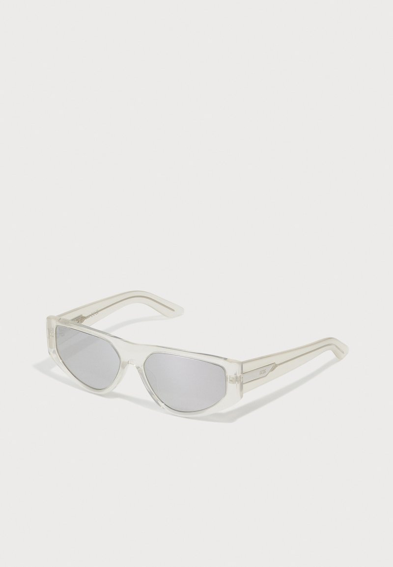Sunglasses with a transparent frame, gray lenses, angular design, and narrow temples featuring a subtle logo accent.